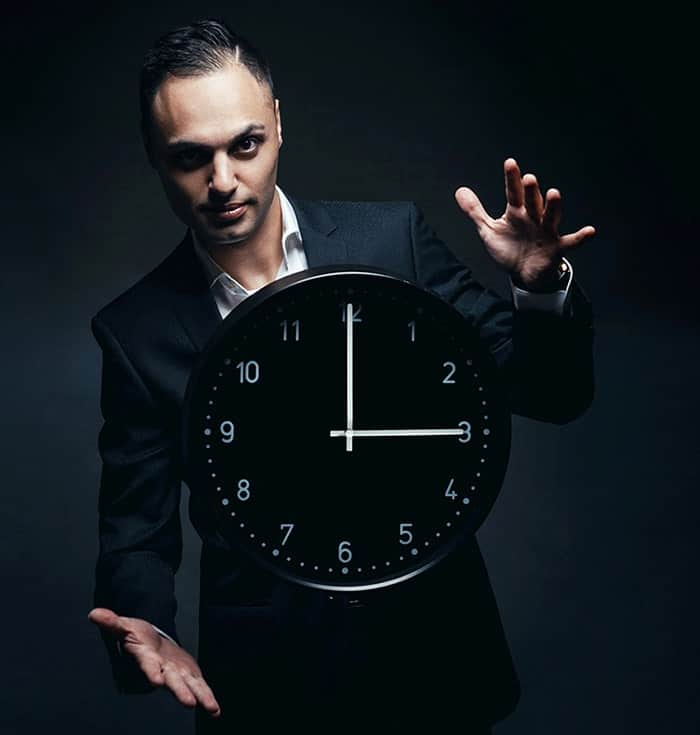 Illusionist making a clock float